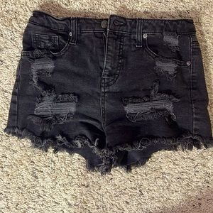 High rise black ripped jean shorts.